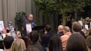 Photo of Paul Wells speaking to a crowd at McNally Robinson in Winnipeg.