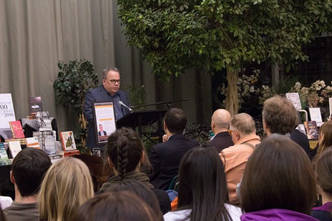 Photo of Paul Wells speaking to a crowd at McNally Robinson in Winnipeg.