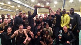 Track and field members celebrate Bison classic win