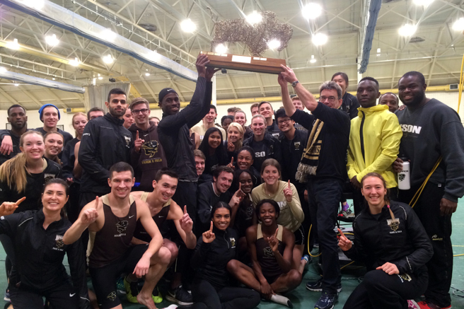 Photo by Jeff Miller Track and field members celebrate Bison classic win
