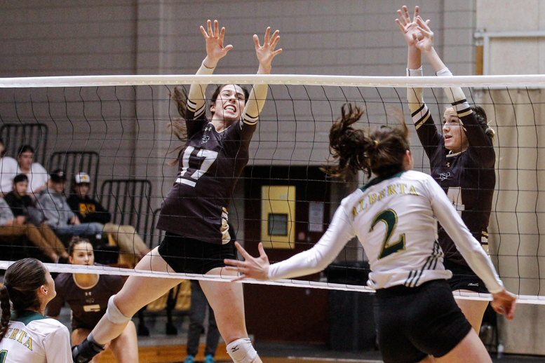 Sports_Womens Volleyball_photo by Star Roxas_web Bison women's volleyball player Sarah Klassen goes in for a block