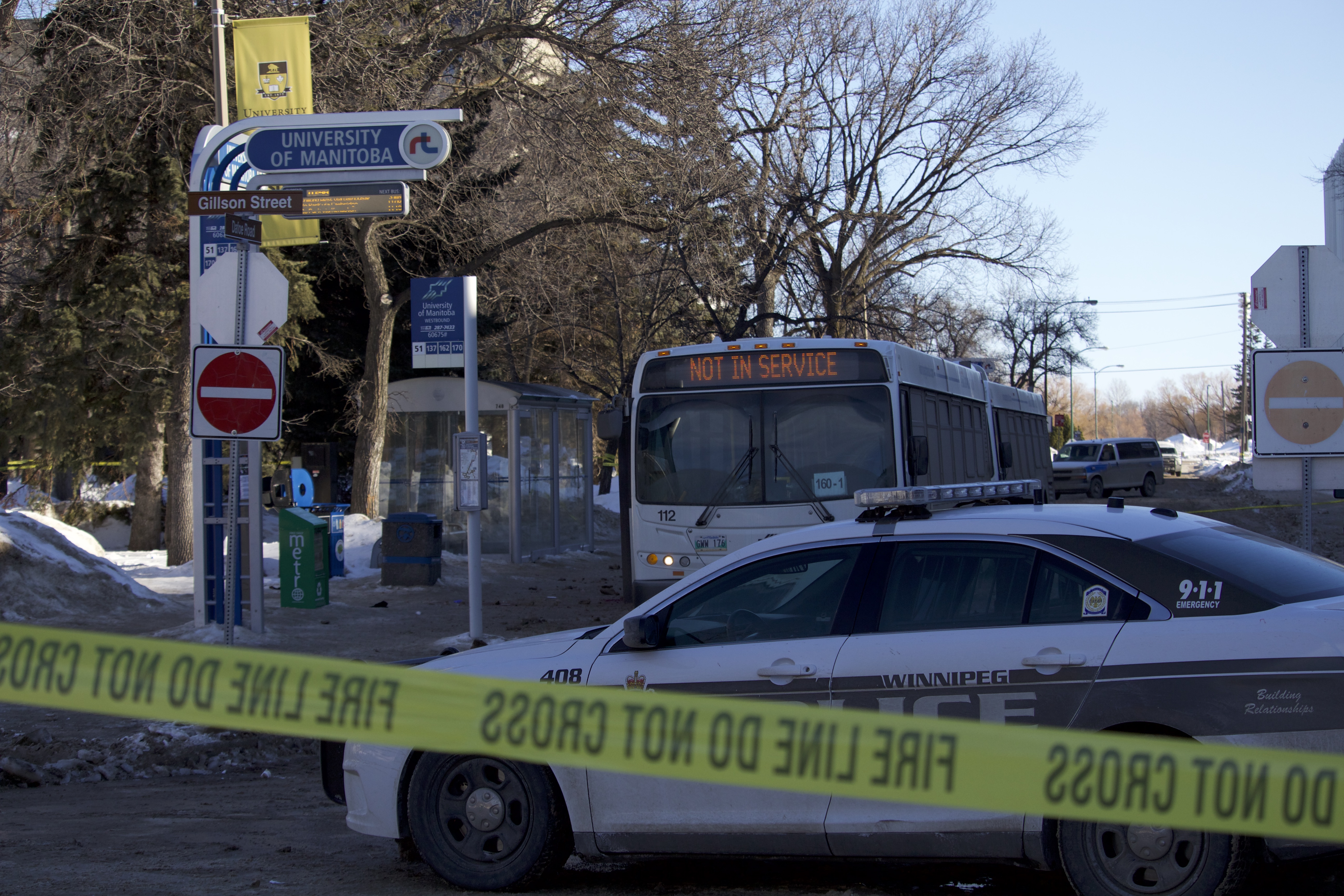 two Photo of a Winnipeg Transit bus parked the morning after a fatal attack on a bus driver.