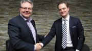 Brandon Wheat King shakes hands with Vegas Golden Knights assistant GM Kelly McCrimmon