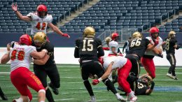 Bison quarterback Theo Deezar is sacked by an oncoming Calgary defender.