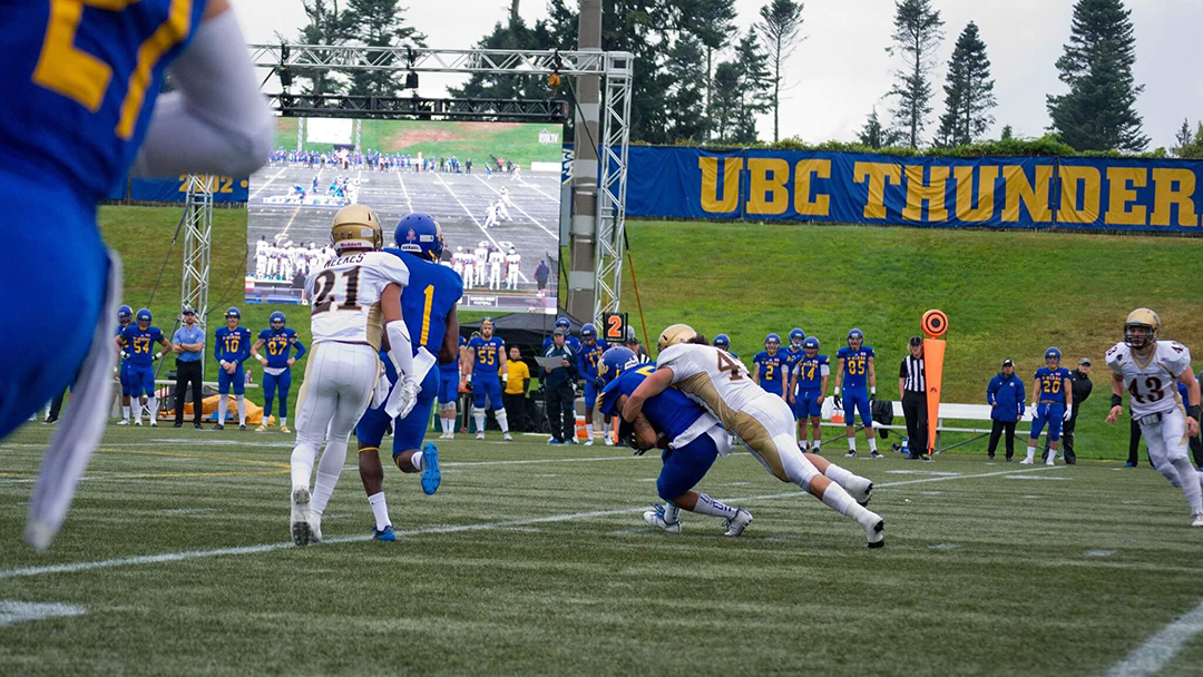 Sports_James Mau_ Photo by Chantel Zdan_RGB (web) James Mau makes a tackle against UBC.