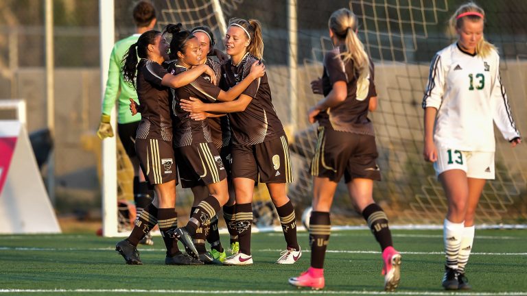 Bisons celebrate their first goal against the Saskatchewan Huskies on Sept. 10. Manitoba won 3-2.