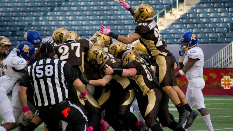 Bisons try to stuff the run against the Thunderbirds.