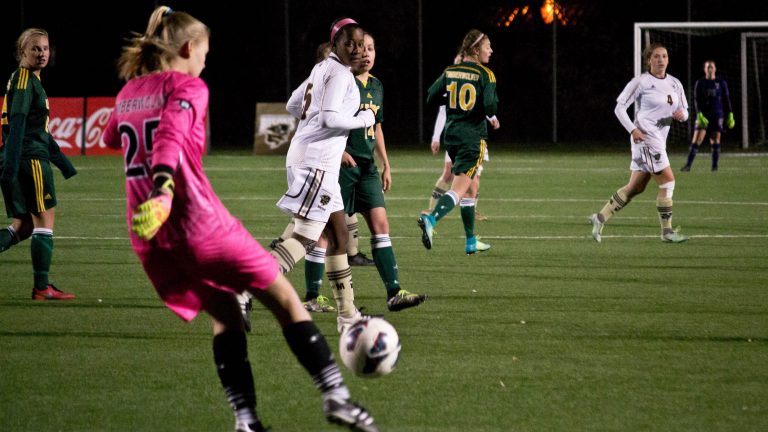 Bison fifth year forward Alyssa Daley creating pressure on a goal kick against UNBC.