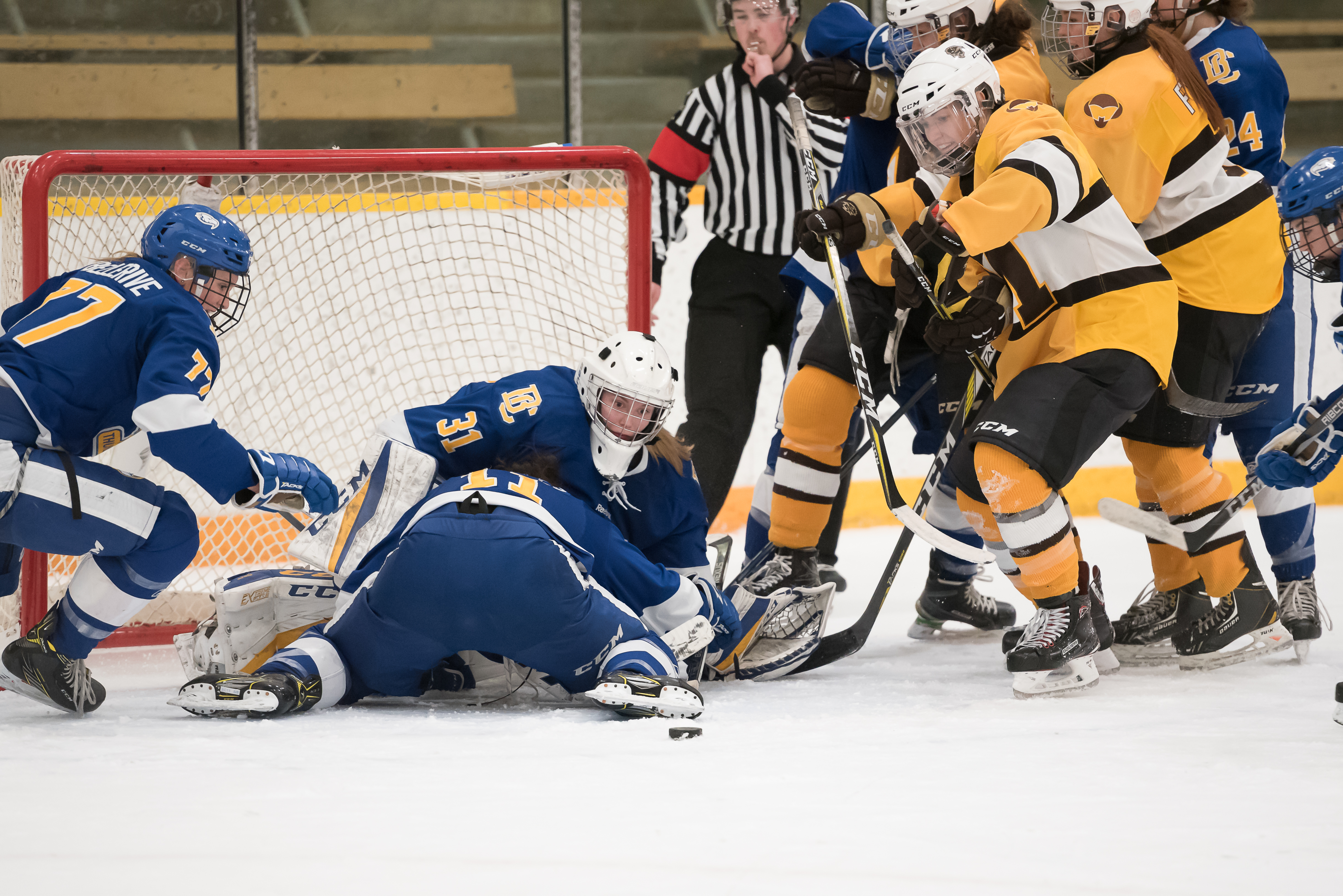 Joe_Oczerklewicz_DST_9445 c1 Bison forward Lauryn Keen rushes for loose puck possession as UBC’s goalie Tory Micklash, Emily Costales and Jenna Fletcher attempt to defend on Saturday, Dec. 2 at the Wayne Fleming Arena. Manitoba won 2-1.