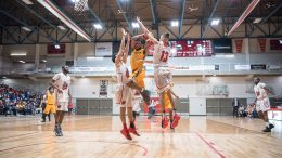 Bison Justus Alleyn (#6) denied the layup by Wesmen Josh Gandier (#8) and Francesco Tocci (#13) in Manitoba's second of two games of the 27th Annual Duckworth Challenge at the Dr. David F. Anderson Gymnasium, University of Winnipeg on Jan. 20. Manitoba lost 89-83.