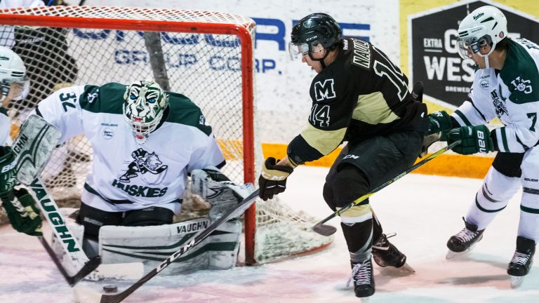 Bison forward Kamerin Nault makes a shot attempt against the Huskies. Photo By Josh Schaefer/Huskie Athletics/GetMyPhoto.ca