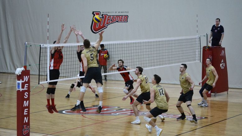 Bison power Scott Vercaigne goes for a spike against a strong Wesmen defence during the 3rd place match at the 51st Classic tournament, on Saturday at the Dr. David F. Gymnasium.