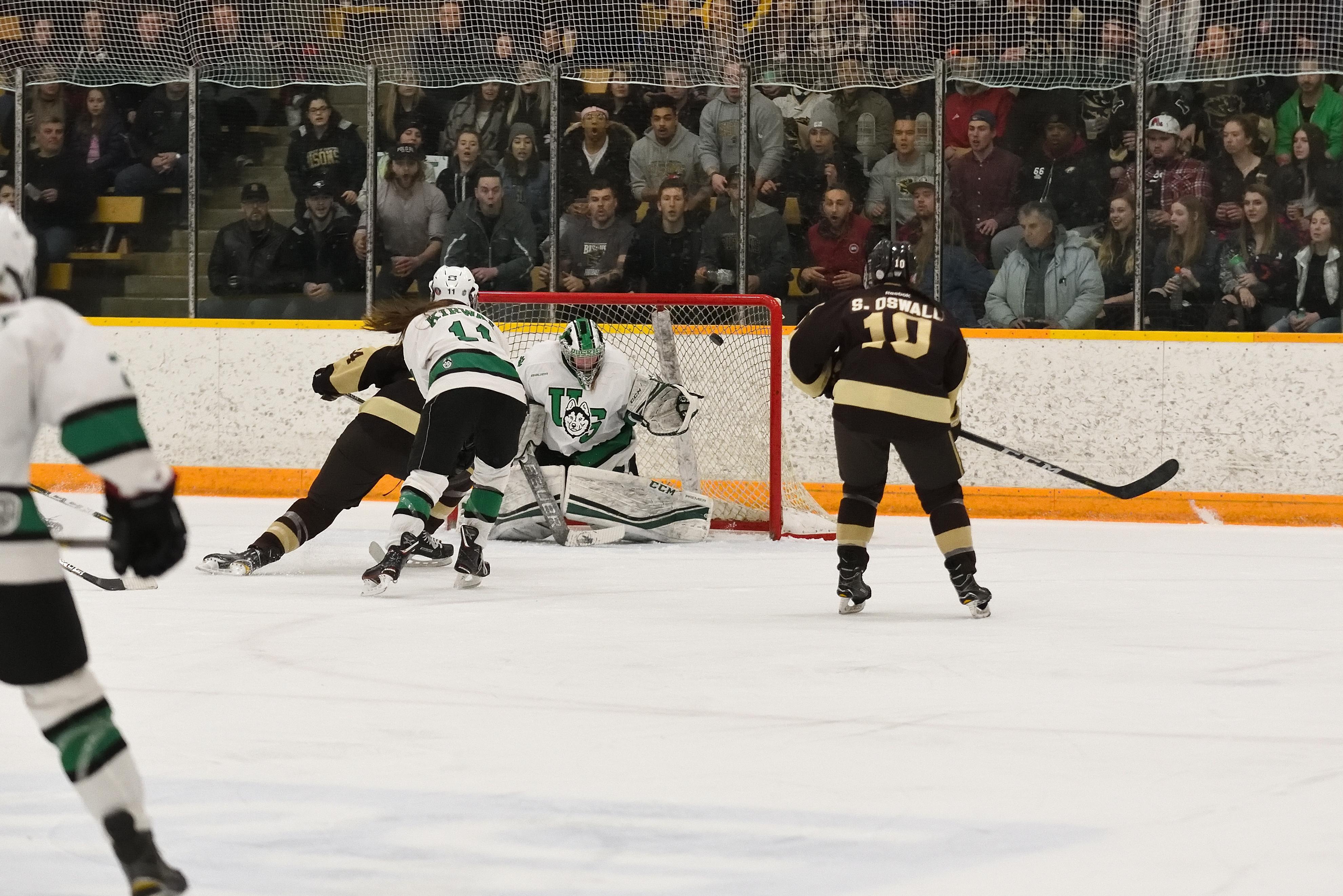 Bison forward Alana Serhan scores a goal while Sheridan Oswald looks on during game two of the Canada West Final at the Wayne Fleming Arena in Winnipeg.