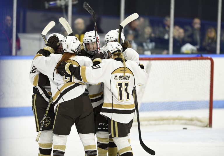 Manitoba celebrates a goal against Queen's on March 16 in their 4-0 quarter final win at the Women's Hockey U SPORTS National Championships in London, Ont.