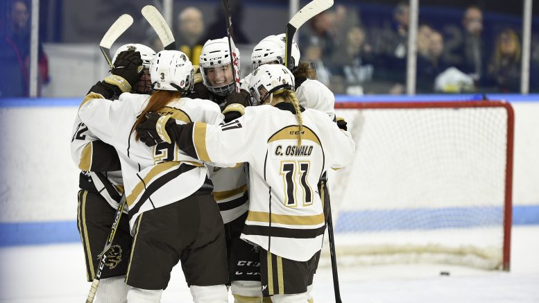 Manitoba celebrates a goal against Queen's on March 16 in their 4-0 quarter final win at the Women's Hockey U SPORTS National Championships in London, Ont.