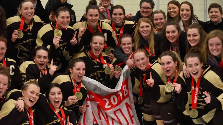 Bisons celebrate winning the Canada West Championship on March 3 at the Wayne Fleming Arena.
