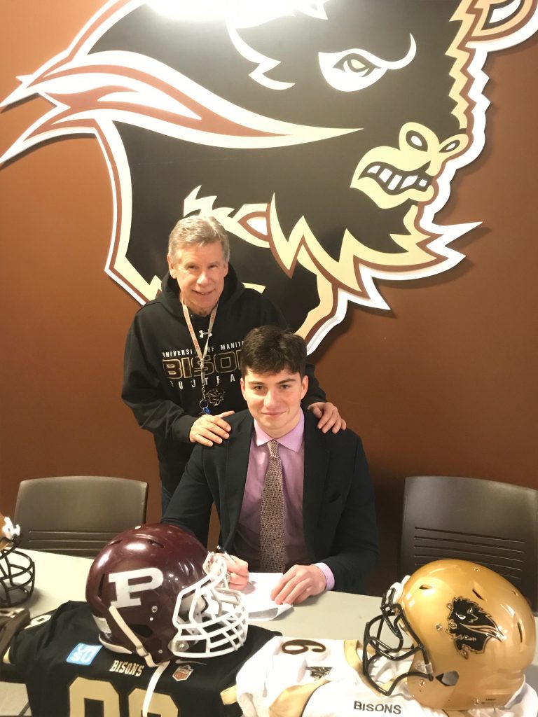 Bison football recruit Noah Dornn with Bison football head coach Brian Dobie. Provided.