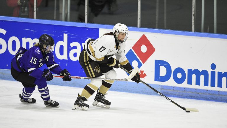 Bison defender Erica Rieder fends off Western Mustangs forward Megan Taylor during the gold medal game at U SPORTS Nationals on March 18 in London, Ont.