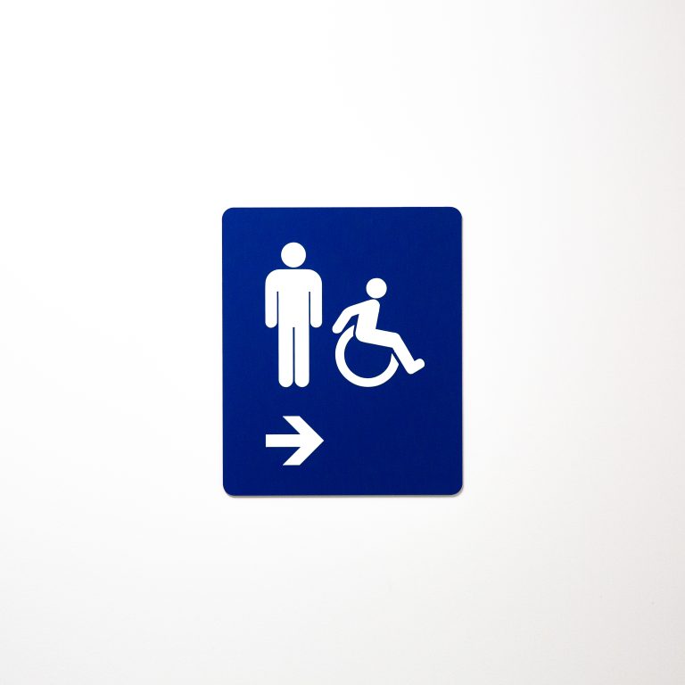 Men’s washroom sign replaced by gender-inclusive sign